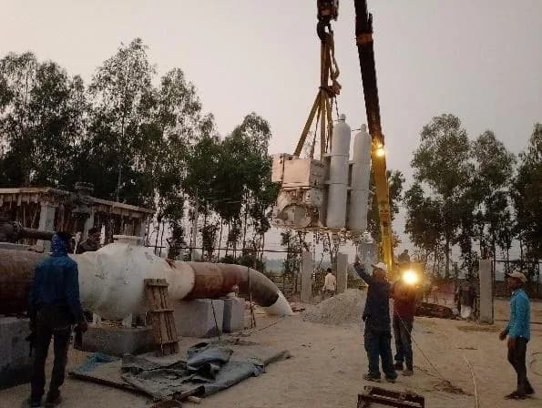 Field welding a pipeline joint at dusk