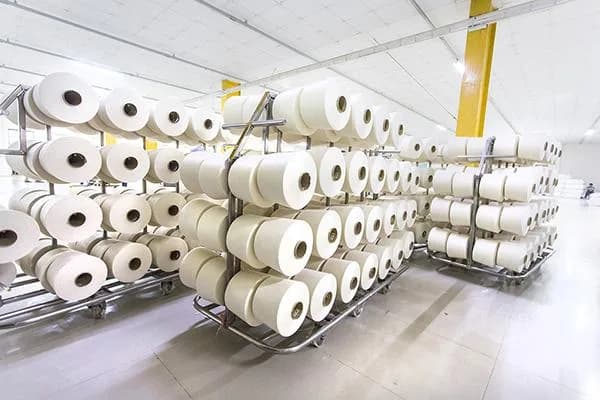 Cones of finished cotton yarn